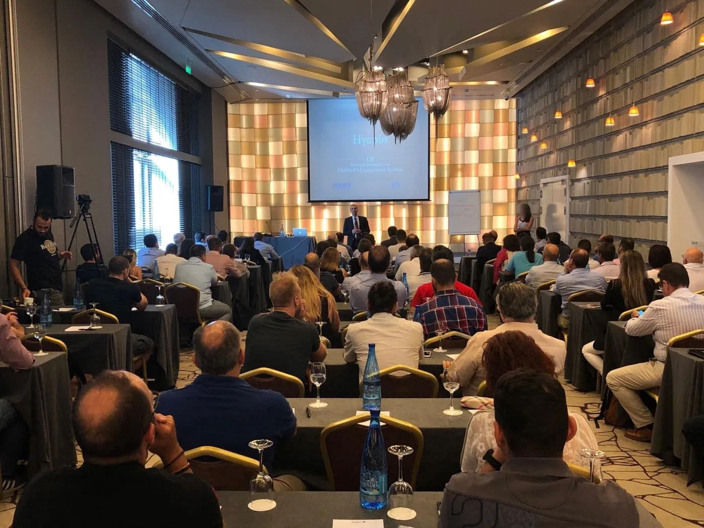 A full seminar room, George Aslanis presenting